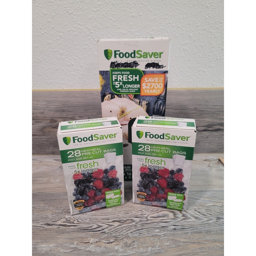 FoodSaver sealing bags pre cut & Rolls sealed in boxes. writting on boxes